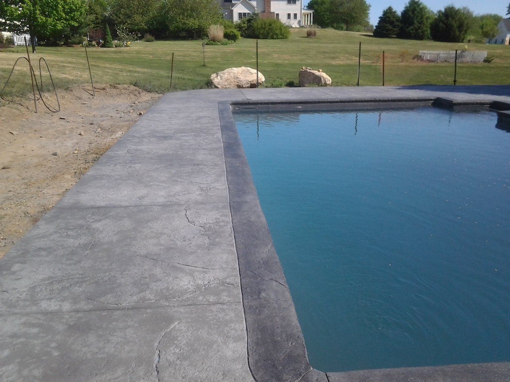 Swimming pool and stamped concrete project example 143